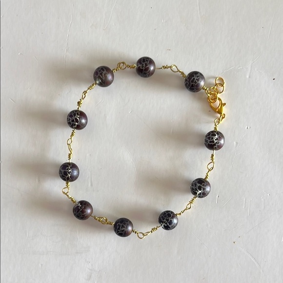 Gold and Black Bracelet with Elegant Bead Design - Picture 4 of 6